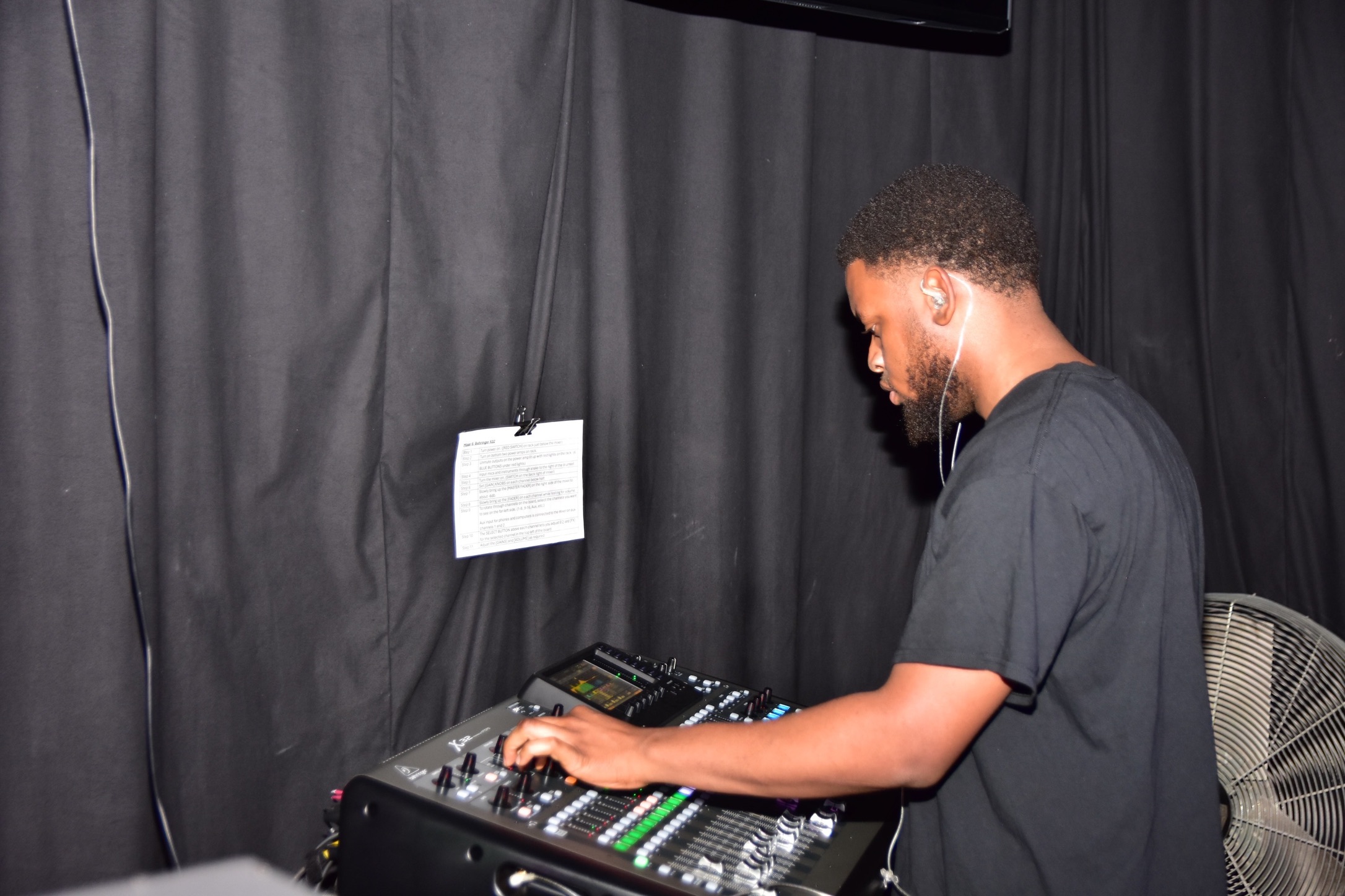 V3 Multimedia videographer operating a professional camera
